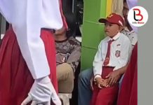 Peringati Hari Merdeka, Bajunya Kekuningan, Siswa SD di Bone Dikeluarkan dari Barisan Lomba Gerak Jalan oleh Sang Guru FOTO: Tangkap layar Siswa SD di Bone Dikeluarkan dari Barisan Lomba Gerak Jalan oleh Sang Guru duduk menelan kekecewaan duduk dipangkuan sang Ayah.