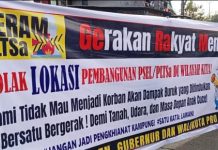 Menolak Proyek Pengolahan Sampah di Parangloe, Tamalanrea FOTO: Spanduk penolakan pembangunan rencana pembangunan Pengelolaan Sampah Menjadi Energi Listrik (PSEL) oleh warga di Kelurahan Mula Baru dan Kampung Tammalalang Kecamatan Tamalanrea, Kota Makassar, Sulawesi Selatan. Selasa (29/7)