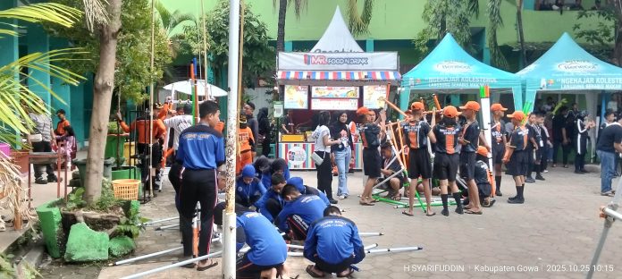 IMG-20251025-WA0050 FOTO: Anggota pramuka tingkat penggalang saat mengikuti lomba menara kaki 4 adalah salah satu jenis perlombaan pionering yang umum diadakan dalam kegiatan Pramuka di SMPN 2 Sungguminasa.
